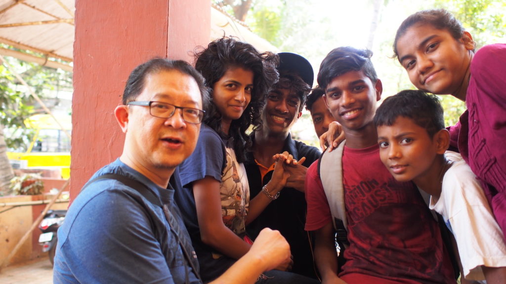 Chinese man with Indian youth