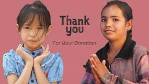 2 girls saying Thank you for your donation