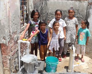 children beside new water bore