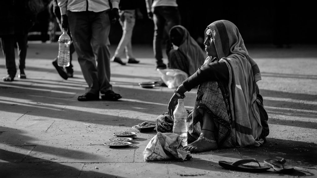 woman begging in India